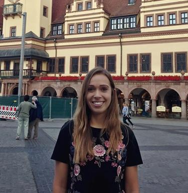 Rebecca Toto standing in front of a building in Leipzig.
