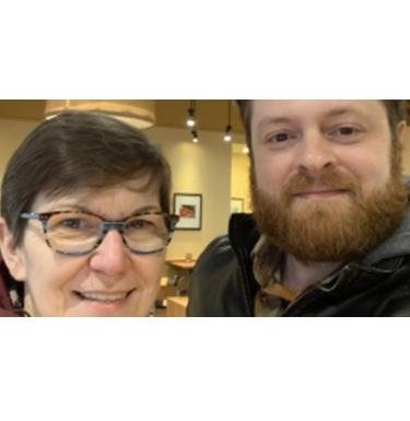 Alumni, Eric Eissler poses next to Sabine Von Dirke.